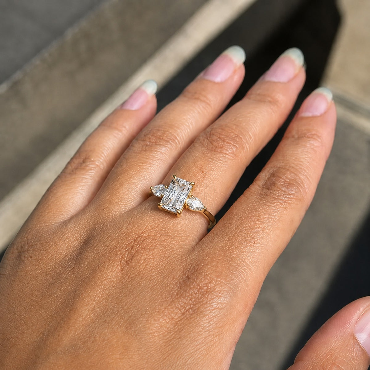 Radiant Three-Stone Moissanite Ring – Gold Pear Side Engagement Ring