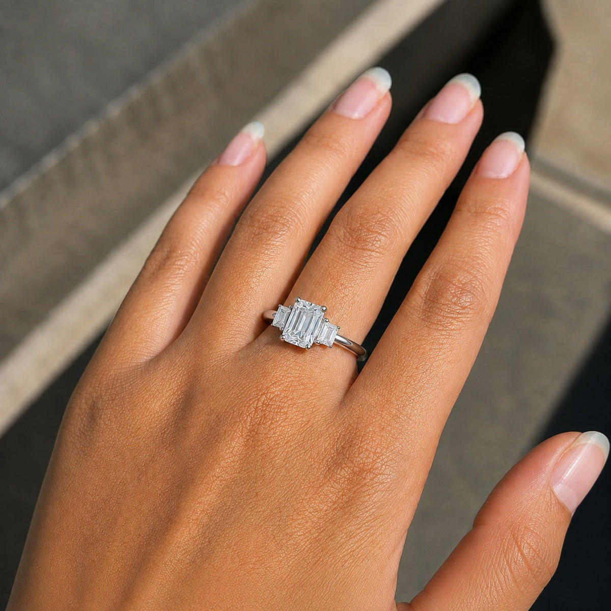 Emerald-Cut Moissanite Three-Stone Engagement Ring with Baguette Side Stones